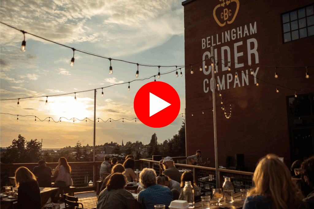 Customers enjoying craft cider on the deck at Bellingham Cider Company, a solar-powered restaurant and production facility.